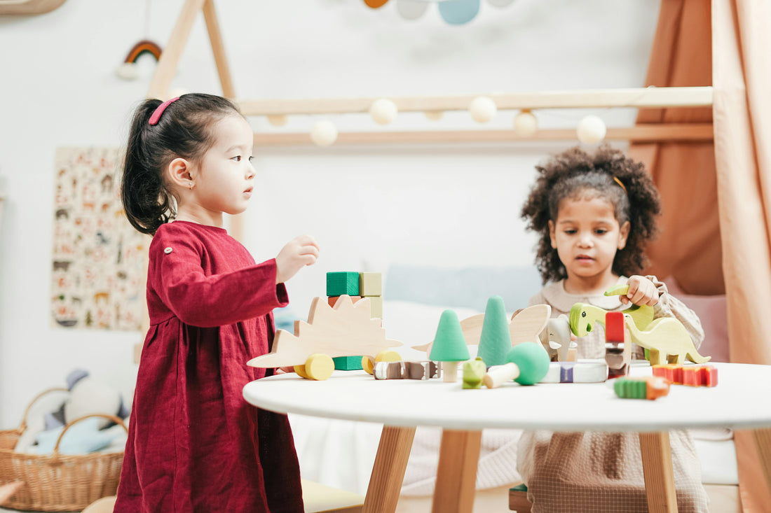 Multicultural children playing with bricks and toys together
